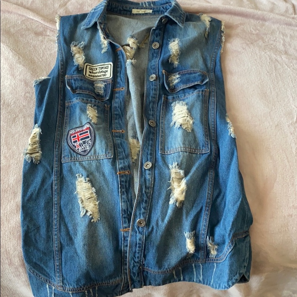 Distressed oversized sleeveless jean jacket